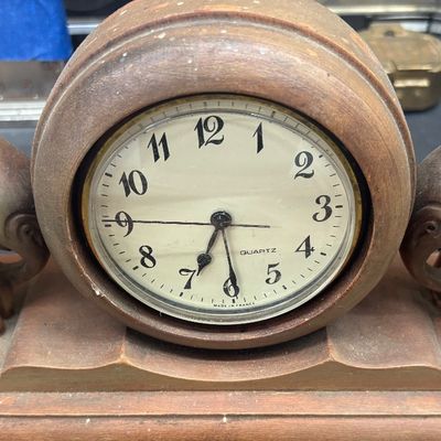 Sale Photo Thumbnail #10: Vintage Art Deco style carved wooden mantel clock featuring flanking elephant figures and a French quartz movement.