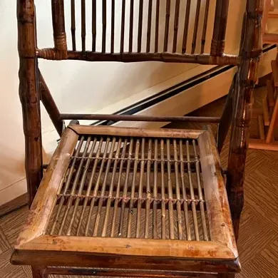 2 Charming vintage bamboo chairs featuring curved spindle backs, woven bamboo seats and a warm natural finish..  A unique accent piece...