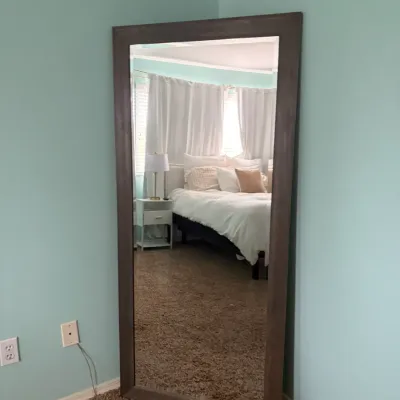 Large rustic wooden full-length standing mirror, featuring a dark stain finish.