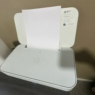 HP Tango compact smart home printer in white, featuring a rear paper tray,