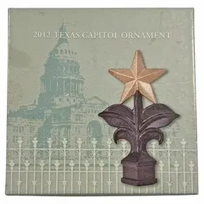 Official 2012 Texas Capitol ornament featuring a metal star finial design, complete in its original decorative box.