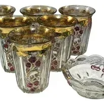 Set of six vintage glass tumblers and a matching small scalloped bowl, featuring hand-painted cherry branch motifs and heavy gold rims.