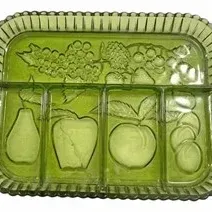 Vintage green glass divided relish tray featuring embossed fruit motifs and side handles, mid-20th century.