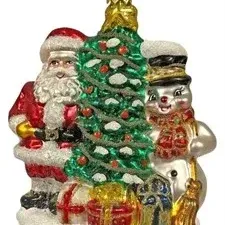 Blown glass Christmas ornament featuring Santa Claus, a decorated pine tree, and a snowman with a broom.