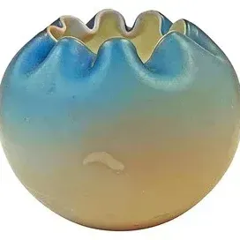 Antique satin art glass rose bowl with a ruffled rim, featuring a blue-to-yellow gradient finish.