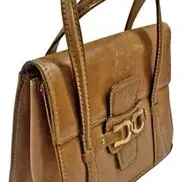 Vintage tan leather handbag with dual top handles, contrast stitching, and gold-tone horsebit-style hardware on the front flap closure.