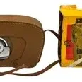 Vintage Kodak brown leather field case for an 8mm movie camera, complete with its original yellow product box.