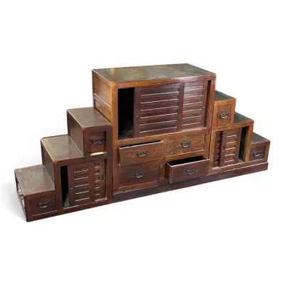 Sale Photo Thumbnail #146: Japanese step chest (Kaidan Tansu) with dark wood finish, metal hardware, and multiple sliding doors and drawers.