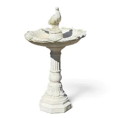 Sale Photo Thumbnail #243: Vintage white cast concrete bird bath featuring a fluted pediment base, scalloped basin, and a central bird topper.