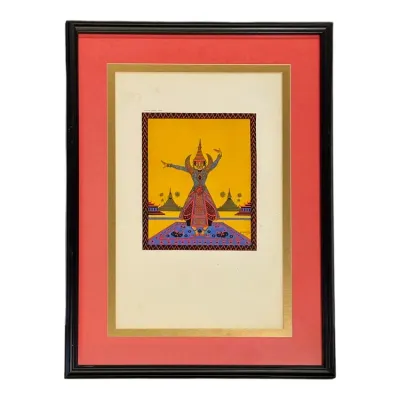 Sale Photo Thumbnail #38: Framed Art Deco style pochoir print depicting a Thai or Balinese dancer, double-matted in gold and coral within a black wooden frame.