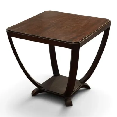 Sale Photo Thumbnail #145: Art Deco style dark wood side table featuring curved, sweeping legs and a lower tier shelf.