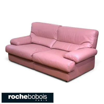 Sale Photo Thumbnail #137: Roche Bobois pink leather two-cushion sofa featuring plush, overstuffed armrests and back pillows.