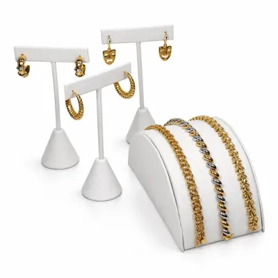 Sale Photo Thumbnail #3: Collection of Vintage 14k and 18K jewelry displayed on stands, including three pairs of earrings and three link-style bracelets.