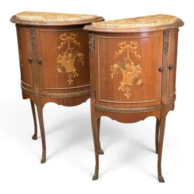 Sale Photo Thumbnail #122: Pair of French Louis XVI style marble-top demilune cabinets featuring floral marquetry inlays, brass mounts, and slender cabriole legs.
