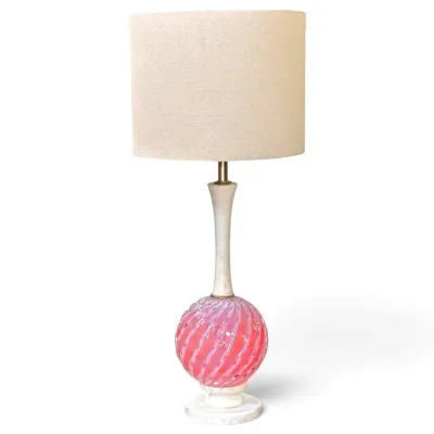 Sale Photo Thumbnail #188: Vintage table lamp featuring a pink and white swirl art glass orb base with alabaster accents, topped with a textured beige drum shade.