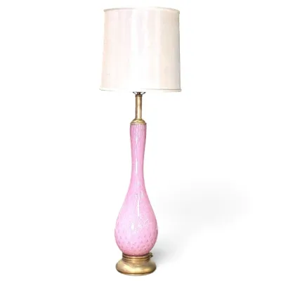 Sale Photo Thumbnail #179: Mid-century pink blown glass table lamp with gold dust fleck detail, brass fittings, and a tall cylindrical white shade.