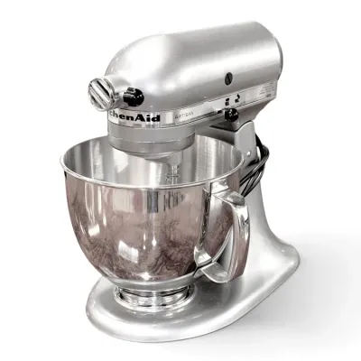Sale Photo Thumbnail #209: KitchenAid Artisan tilt-head stand mixer in metallic chrome finish with matching stainless steel mixing bowl.