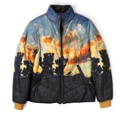 Sale Photo Thumbnail #29: Puffer jacket featuring a graphic print of a desert sunset with Joshua trees under a starry night sky.