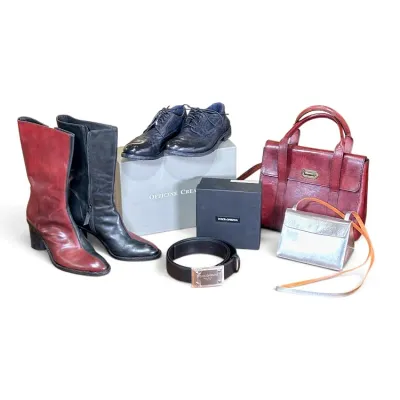 Sale Photo Thumbnail #20: Collection of designer leather goods including red and black leather boots, Officine Creative oxfords, a Dolce & Gabbana belt with box, a red leather tote, and a small silver metallic crossbody bag.