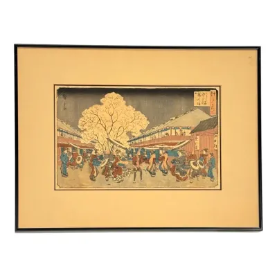 Sale Photo Thumbnail #32: Framed Japanese ukiyo-e woodblock print depicting a lively street scene in Edo, set in a simple black frame with wide beige matting.