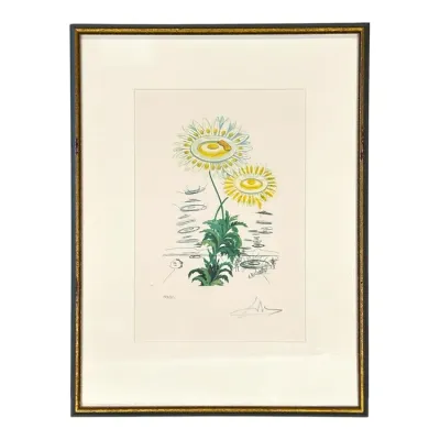 Sale Photo Thumbnail #75: Framed Salvador Dalí surrealist floral print, pencil-signed and numbered, presented in a black and gold-toned frame.