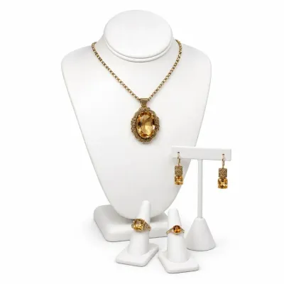 Sale Photo Thumbnail #2: Vintage 14k and 18K jewelry set featuring faceted amber-colored glass or citrine stones, including an oval pendant necklace, matching drop earrings, and two statement rings.