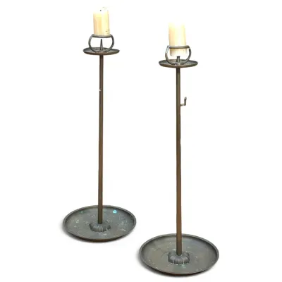 Sale Photo Thumbnail #181: Pair of tall vintage brass pricket candle holders with wide dish bases, exhibiting a naturally aged patina.