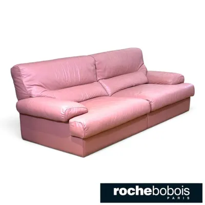 Sale Photo Thumbnail #136: Vintage Roche Bobois pink leather sofa featuring plush pillow-top cushioning and a low-profile silhouette.