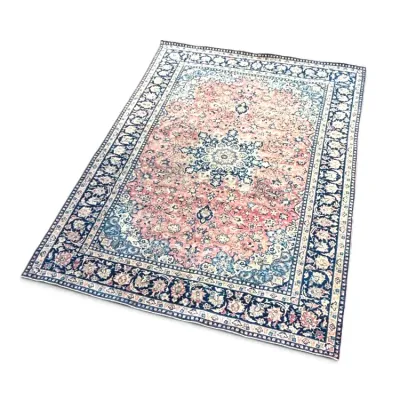 Sale Photo Thumbnail #143: Vintage Persian-style area rug featuring a central medallion with floral motifs in shades of pink, navy blue, and cream.