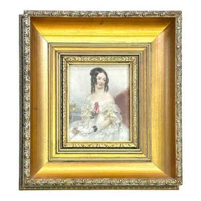 Sale Photo Thumbnail #56: 19th-century miniature portrait watercolor of a seated woman in a ruffled white dress, housed in an ornate, multi-tiered gilded frame.