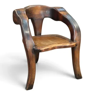 Sale Photo Thumbnail #135: Handcrafted studio craft carved wooden armchair featuring thick, organic lines and a contoured seat.