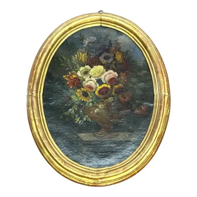 Sale Photo Thumbnail #82: Antique Dutch Master style floral still life oil painting in an oval gilt wood frame.