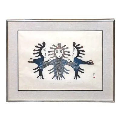 Sale Photo Thumbnail #109: Framed Inuit stonecut print by Pudlo Pudlat, depicting stylized human and avian figures, professionally matted in a silver-tone metal frame.
