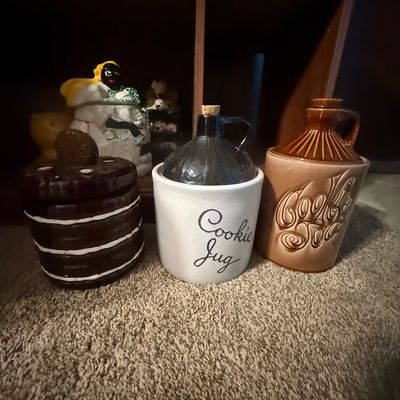 Sale Photo Thumbnail #20: Collection of vintage ceramic cookie jars, including a stacked Oreo design, a stoneware "Cookie Jug," and a brown glazed jug form.