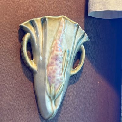 Sale Photo Thumbnail #17: Vintage Roseville Art Pottery Foxglove pattern wall pocket vase in light green and pink glazes with fine crazing.