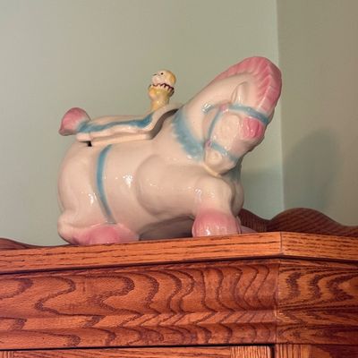 Sale Photo Thumbnail #14: Vintage mid-century glazed ceramic circus horse cookie jar featuring pastel pink and blue hand-painted accents.