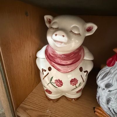 Sale Photo Thumbnail #24: Vintage ceramic pig cookie jar with painted floral details and a red neckerchief.