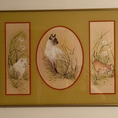 Sale Photo Thumbnail #52: Vintage framed triptych-style wall art featuring illustrations of cats and kittens among tall grass and flowers, set in a metallic gold-tone frame.