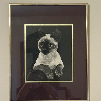 Sale Photo Thumbnail #53: Framed Siamese cat print or etching, double-matted in burgundy and gold, housed in a thin gold-tone metal frame.