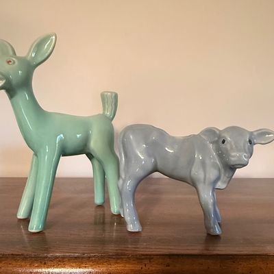 Sale Photo Thumbnail #54: Pair of mid-century ceramic animal figurines, featuring a stylized mint green deer and a soft blue calf with glossy glazed finishes.
