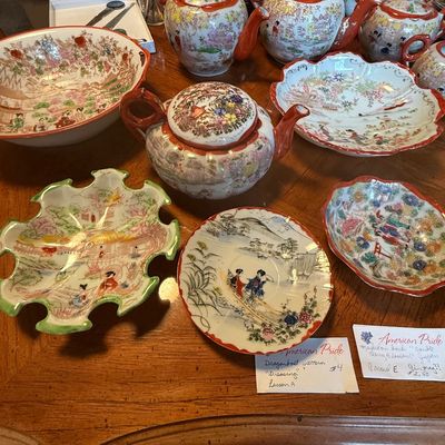 Sale Photo Thumbnail #90: Collection of vintage hand-painted Japanese porcelain teapots, serving bowls, and saucers featuring detailed floral and figurative motifs.