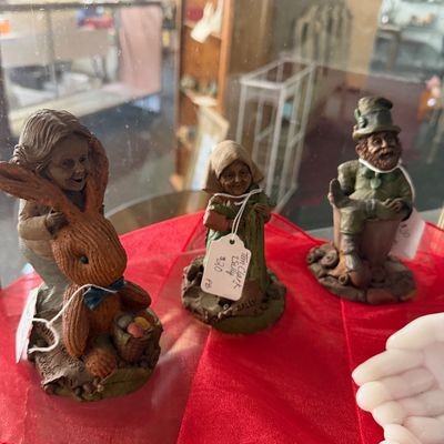 Trio of vintage Tom Clark Cairn Studio gnome and storybook figurines, including 'Sally' and a leprechaun character, displayed...