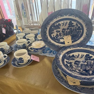 Collection of Churchill Blue Willow pattern transferware chinaware, including an oval platter, plates, covered bowl, and teacups with...