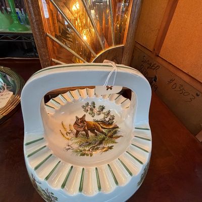 Vintage ceramic basket-style ashtray with a handle, featuring a painted fox design and fluted green-accented edges.