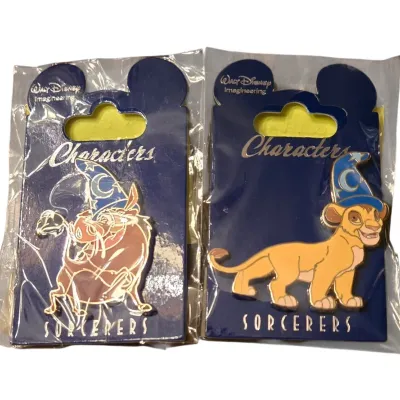 Sale Photo Thumbnail #28: Pair of Walt Disney Imagineering Sorcerers enamel pins featuring Pumbaa and Simba from The Lion King, sealed in original plastic packaging.