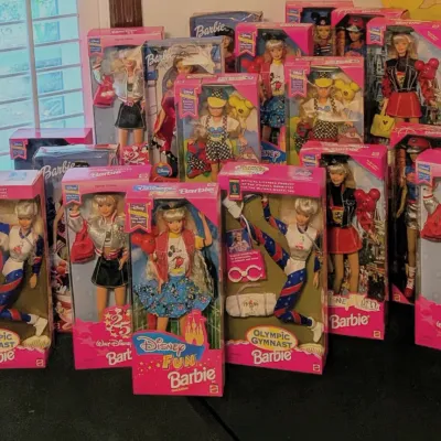 Sale Photo Thumbnail #66: Collection of vintage 1990s Mattel Barbie dolls in original unopened boxes, including Disney Fun, Walt Disney World 25th Anniversary, and 1996 Atlanta Olympic Gymnast editions.