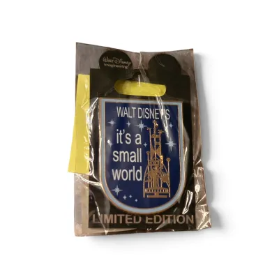 Sale Photo Thumbnail #27: Walt Disney Imagineering limited edition "it's a small world" collectible enamel pin, sealed in original packaging.