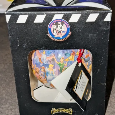 Sale Photo Thumbnail #59: 1998 Official Disneyana Convention hand-painted glass ornament in original display box, limited edition of 1,800 pieces featuring classic Disney characters.