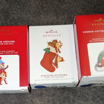 Sale Photo Thumbnail #40: Trio of boxed Hallmark Keepsake Christmas tree ornaments featuring Disney's Chip and Dale, including "Dragon Around", "Stocking Stuffers", and "Cookie Cutter Christmas".