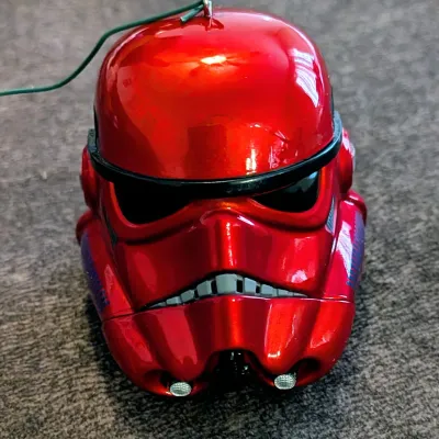 Sale Photo Thumbnail #69: Metallic red Star Wars Sith Trooper helmet ornament featuring a glossy finish and attached hanging wire.